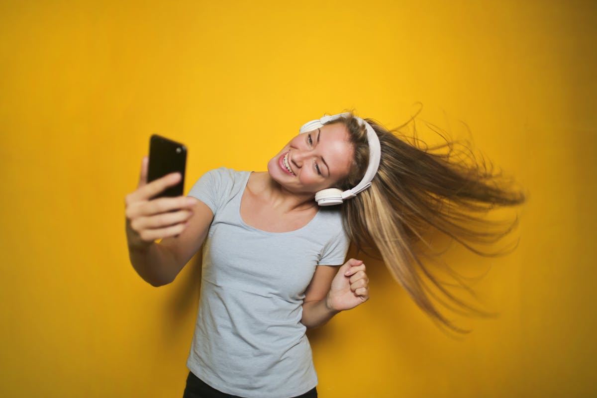 A creator filming a short safe-for-work video on a phone for TikTok